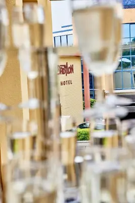 a hotel sign in front of a building at Hotel Babylon Heerhugowaard - Alkmaar in Heerhugowaard
