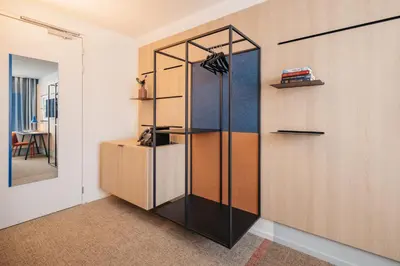 a room with a closet with a glass partition at Hotel Casa Amsterdam in Amsterdam