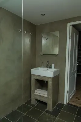a bathroom with a sink and a shower at Paardenstal, Private House with wifi and free parking for 1 car in Weesp