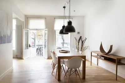 a kitchen and dining room with a table and chairs at Marnix360apartments Design in Amsterdam