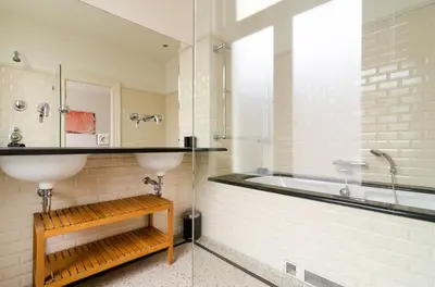 a bathroom with a sink and a bath tub at Marnix360apartments Classic in Amsterdam