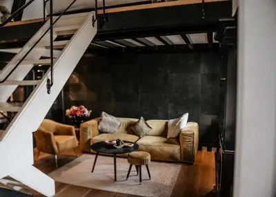 a living room with a couch and a table at Villa Beukenhof in Oegstgeest