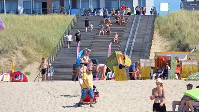 a group of people on the beach at the beach at Beach House Sea-Esta in Egmond aan Zee
