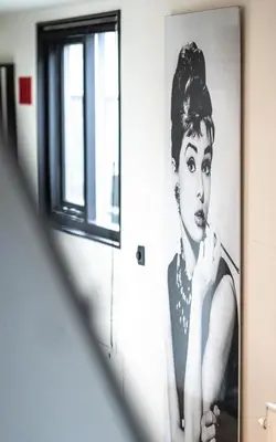 a picture of a woman on a wall in a mirror at Houseboat-Amsterdam in Amsterdam