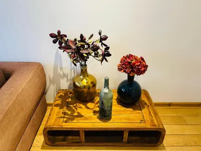 three vases sitting on a table on a coffee table at Red light district B & B canal view in Amsterdam
