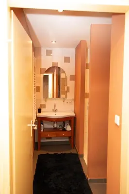 a bathroom with a sink and a mirror at Red light district B & B canal view in Amsterdam