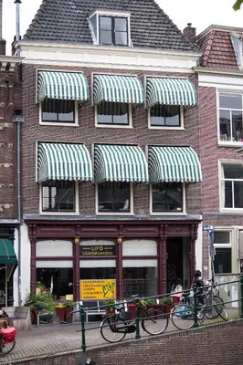 a building with bikes parked in front of it at NR22 Leiden in Leiden