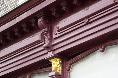 a building with a gold ornament on the side of it at NR22 Leiden in Leiden