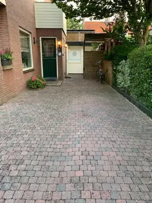 a brick driveway in front of a house at Studio De Laan in Zandvoort