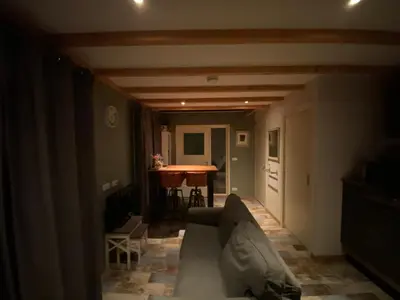 a living room with a couch and a table at Appartement - B&B de Koog in Uitgeest