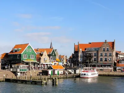 a group of buildings next to a body of water at Van der Valk Hotel Oostzaan - Amsterdam in Oostzaan