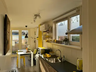 a kitchen with a sink and a counter top at Coastal Dreaming in Egmond aan Zee