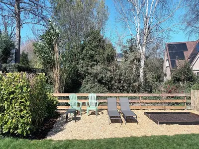 three chairs and a bench in a yard at Groet Villa Stay with Garden Views in Groet