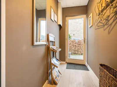 a hallway with a room with a door and a window at Apartment in Bergen near Schoorl Dunes in Bergen