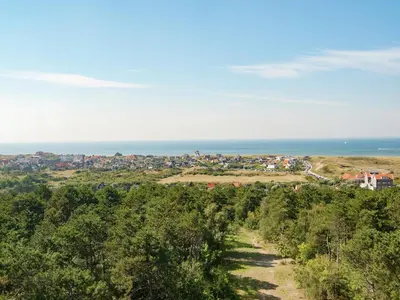 a view of a town and the ocean at Apartment in Bergen aan Zee near the Beach in Bergen aan Zee