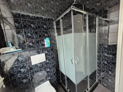 a bathroom with a shower and a toilet at Studio Slijterij Zandvoort in Zandvoort