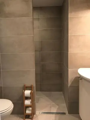 a bathroom with a toilet and a sink at Dreamview Apartment in Zandvoort