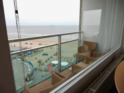 a room with a view of the beach and the ocean at Dreamview Apartment in Zandvoort