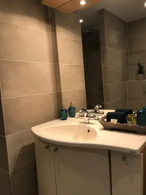 a bathroom with a sink and a mirror at Dreamview Apartment in Zandvoort