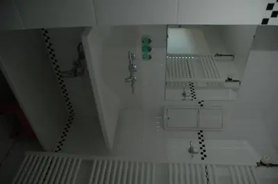 an overhead view of a bathroom with a sink at Pension 't hofje 350 meter van het strand in Noordwijk aan Zee