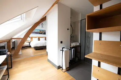 a room with a staircase leading to a bedroom at Boutique Hotel d'Oude Morsch in Leiden