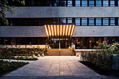 a building with a bunch of lights on it at Hotel V Fizeaustraat in Amsterdam