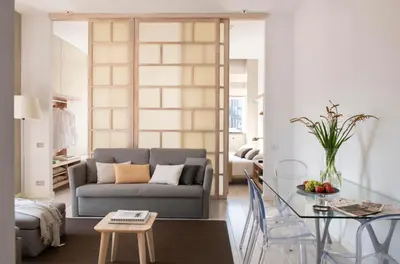 a living room with a couch and a table at Eric Vökel Boutique Apartments - Amsterdam Suites in Amsterdam