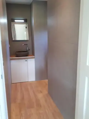 a bathroom with a sink and a mirror at Lodges near the Rhine - Sustainable Residence in Hazerswoude-Rijndijk