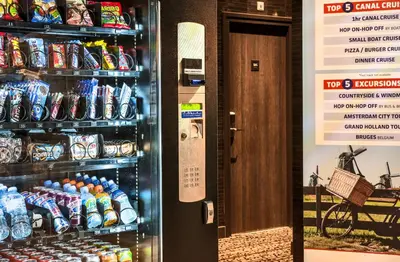 a refrigerator filled with lots of cans of soda at The Alfred Hotel in Amsterdam