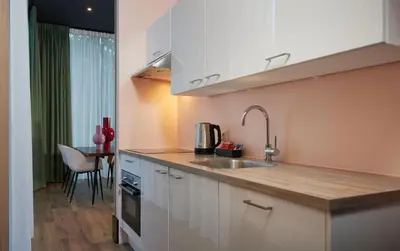 a kitchen with a sink and a counter top at Hotel2Stay in Amsterdam