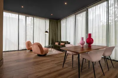 a living room with a table and chairs at Hotel2Stay in Amsterdam
