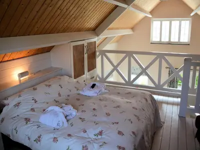a bedroom with a bed with towels on it at Holiday Home in Noordwijk near Beach in Noordwijk