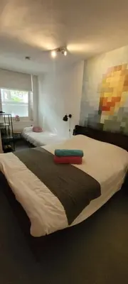 a bedroom with two beds and a window at H 58 in Amsterdam