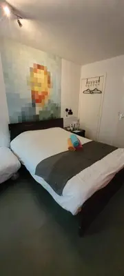 a bedroom with a large bed in a room at H 58 in Amsterdam
