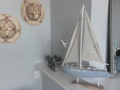 a model boat on a shelf in a mirror at Benny's Beach House 2 in Zandvoort