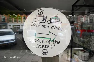 a sign on the window of a coffee and coffee corner of the street at 2 bedroom loft near Rijksmuseum in Amsterdam