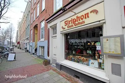 a store front of a building on a city street at 2 bedroom loft near Rijksmuseum in Amsterdam