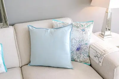 a white couch with two pillows on it at Dare to be different in Zandvoort