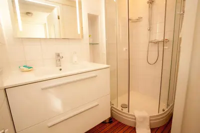 a bathroom with a sink and a shower at Prince Royal B&B in Amsterdam