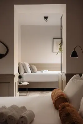 a bedroom with a bed and a large window at Adam Downtown in Amsterdam