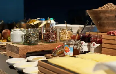a table with jars of food and other ingredients at Conscious Hotel The Tire Station in Amsterdam