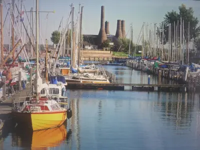 a group of boats docked in a marina at Hövell in Huizen