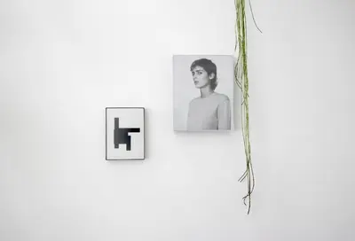 two pictures of a woman on a white wall at Beautiful 2 floor Vondelpark apartment. in Amsterdam