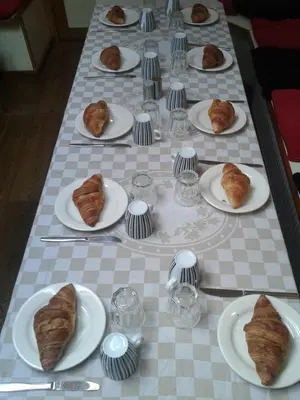 a long table with plates of pastries on it at Zeilschip De Vrouw Dina in Leiden