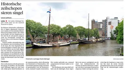 a page of a magazine with three boats in a river at Zeilschip De Vrouw Dina in Leiden