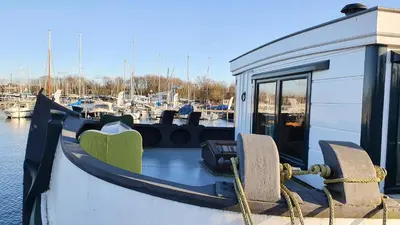 a boat is docked at a marina at Marinaparcs Naarden in Naarden