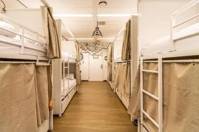 a hallway of bunk beds in a dorm room at Hostelle - women only hostel Amsterdam in Amsterdam