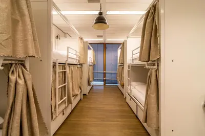 a hallway of a hostel with bunk beds at Hostelle - women only hostel Amsterdam in Amsterdam