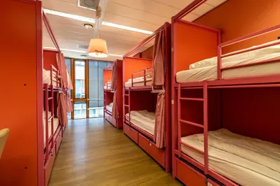 a group of bunk beds in a room at Hostelle - women only hostel Amsterdam in Amsterdam