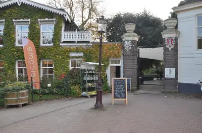 a street light and a sign in front of a building at Perfect APT - Heart of Amsterdam in Amsterdam